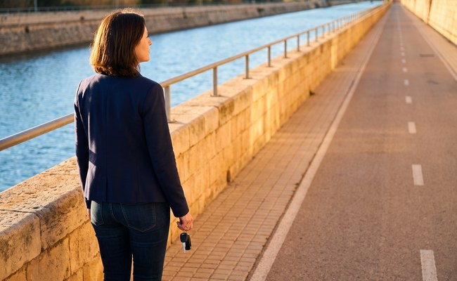 A person adult reviews the next comparison step while considering voluntary repossession vs selling car.
