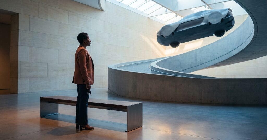 A person adult borrower considers how to verify and resolve a car loan deficiency balance in a contemporary mobility gallery.