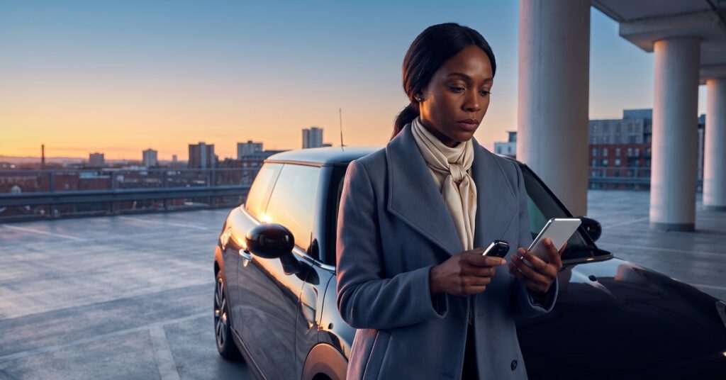 A person considers auto loan refinancing worth it while comparing payment, APR, and total cost.