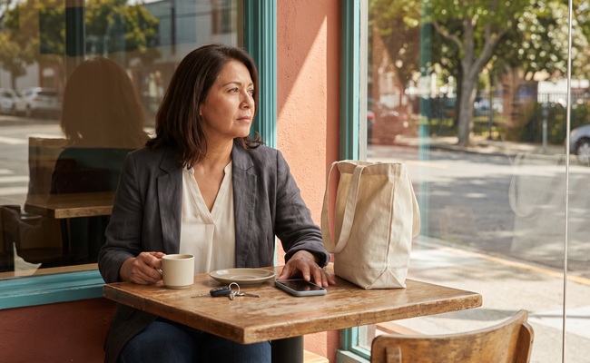 A person adult checking transaction context before disputing a debit card charge.