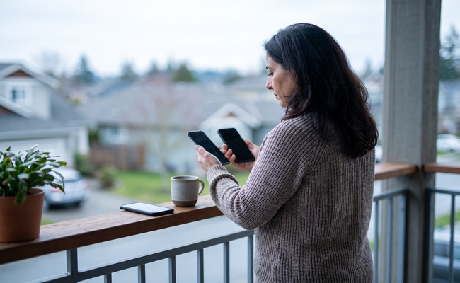 An adult borrower carefully checks a student loan servicer transfer using official account channels.