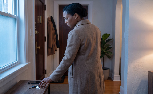 An adult borrower gathers herself before checking whether student loan wage garnishment affects her pay.
