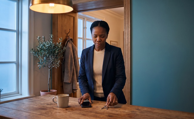 An adult borrower prepares to verify an IRS bank levy notice before reacting to a frozen account.
