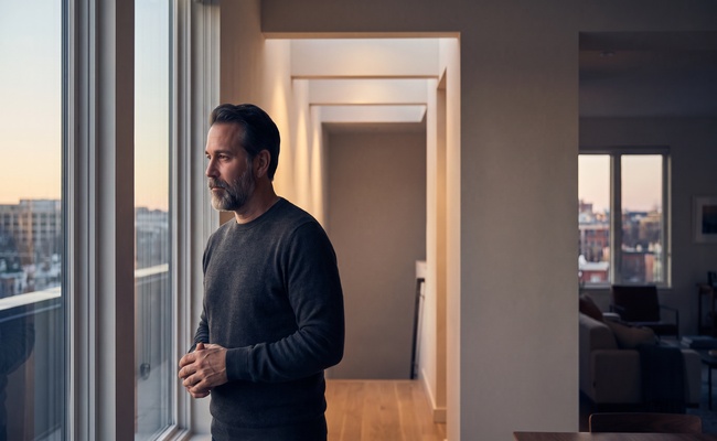 An adult borrower considers separate tax categories in a calm architectural setting.