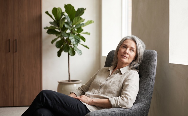 An adult sits back in an uncluttered office chair and takes a measured breath.