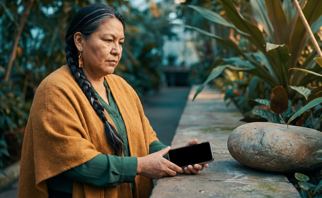 A woman reviewing credit-report concerns after missed buy now pay later payments.